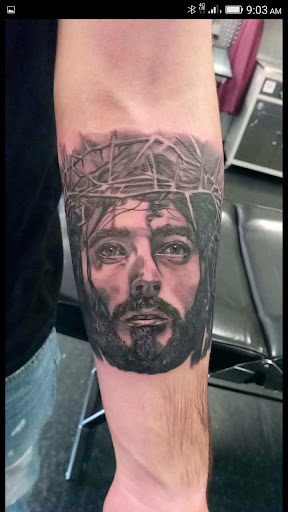 Explore bear paw tattoo ideas, creative tattoo ideas in Hilliard, available at 22 Caliber Tattoo Mega Studio