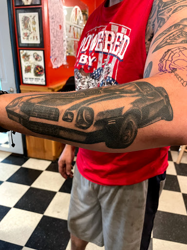 Explore dolphin tattoo ideas, creative tattoo ideas in Black River Falls, available at Black River Tattoo