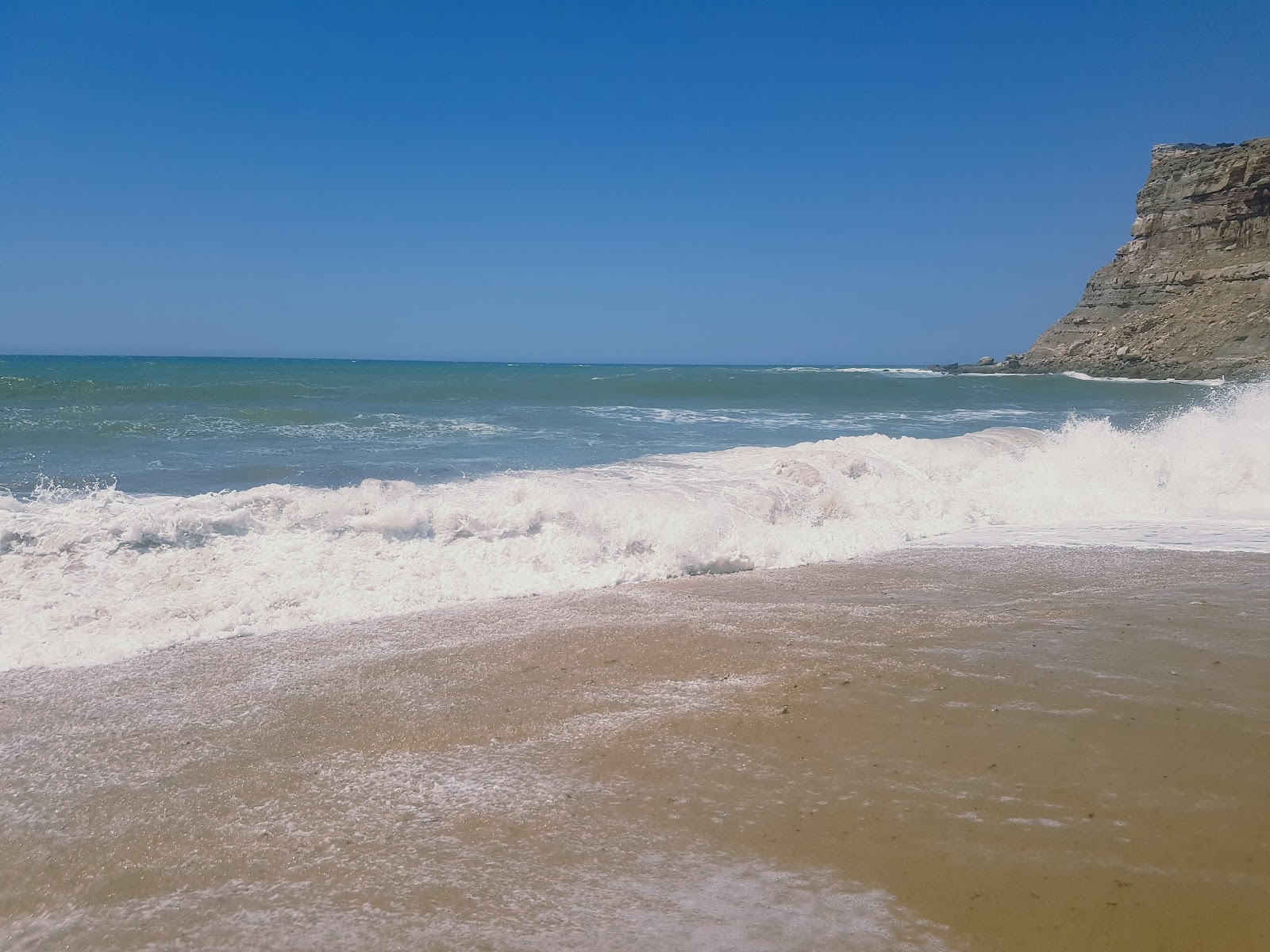 Foto van Praia da Calada met turquoise puur water oppervlakte