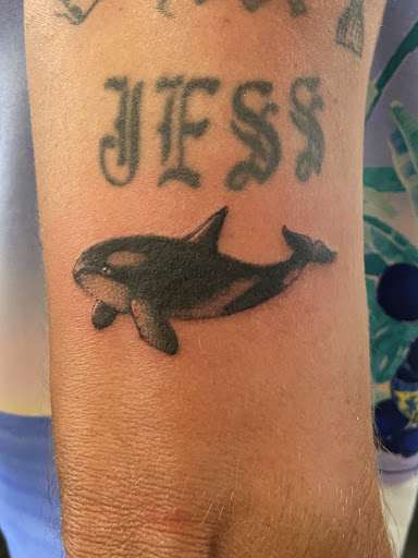 Explore iris flower tattoo ideas, creative tattoo ideas in Kissimmee, available at Fallen Heroes Tattoo & Piercing (Florida)