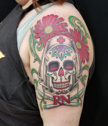 Explore music tattoo sleeve ideas, creative tattoo ideas in Galesburg, available at Hawks Tattoos