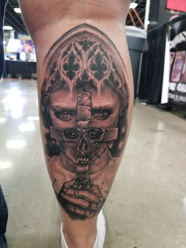 Find tattoos in between breast ideas for your next unique tattoo in Spartanburg at The Gallery Tattoo Shop Spartanburg