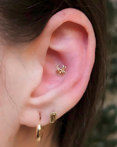 Explore solid black tattoo ideas, creative tattoo ideas in Chicago, available at Identity Body Piercing