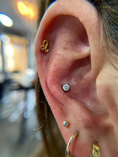 Explore tattoo ideas cover up names, creative tattoo ideas in Orange, available at Symbiosis Body Piercing