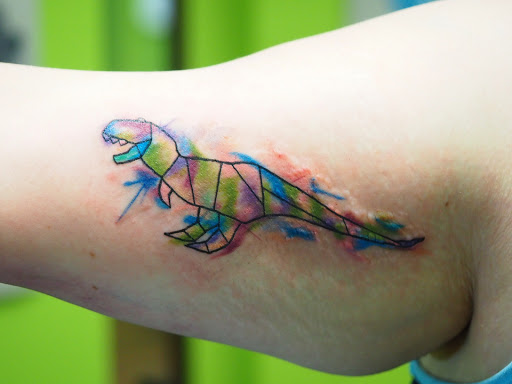 Explore back of neck tattoo cover up ideas, creative tattoo ideas in Springfield, available at Poke and a Rub art studio