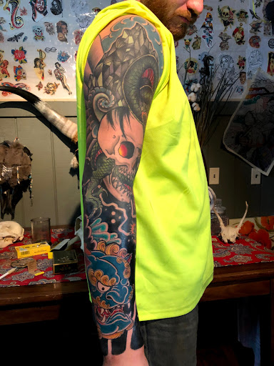 Explore tattoo ideas guns, creative tattoo ideas in Kingsford, available at Deft Tattoo Studio