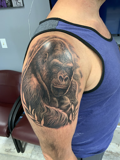 Explore spine tattoo ideas for men, creative tattoo ideas in Des Moines, available at Skin Kitchen Tattoo