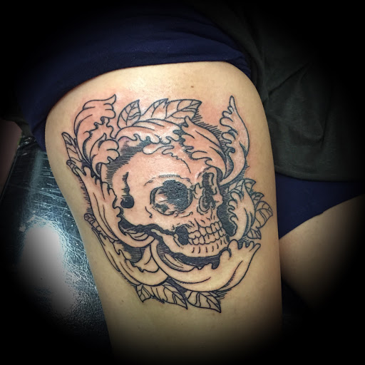 Explore half sleeve flower tattoo ideas, creative tattoo ideas in Washington, available at Fattys Tattoos & Piercings Dupont Circle