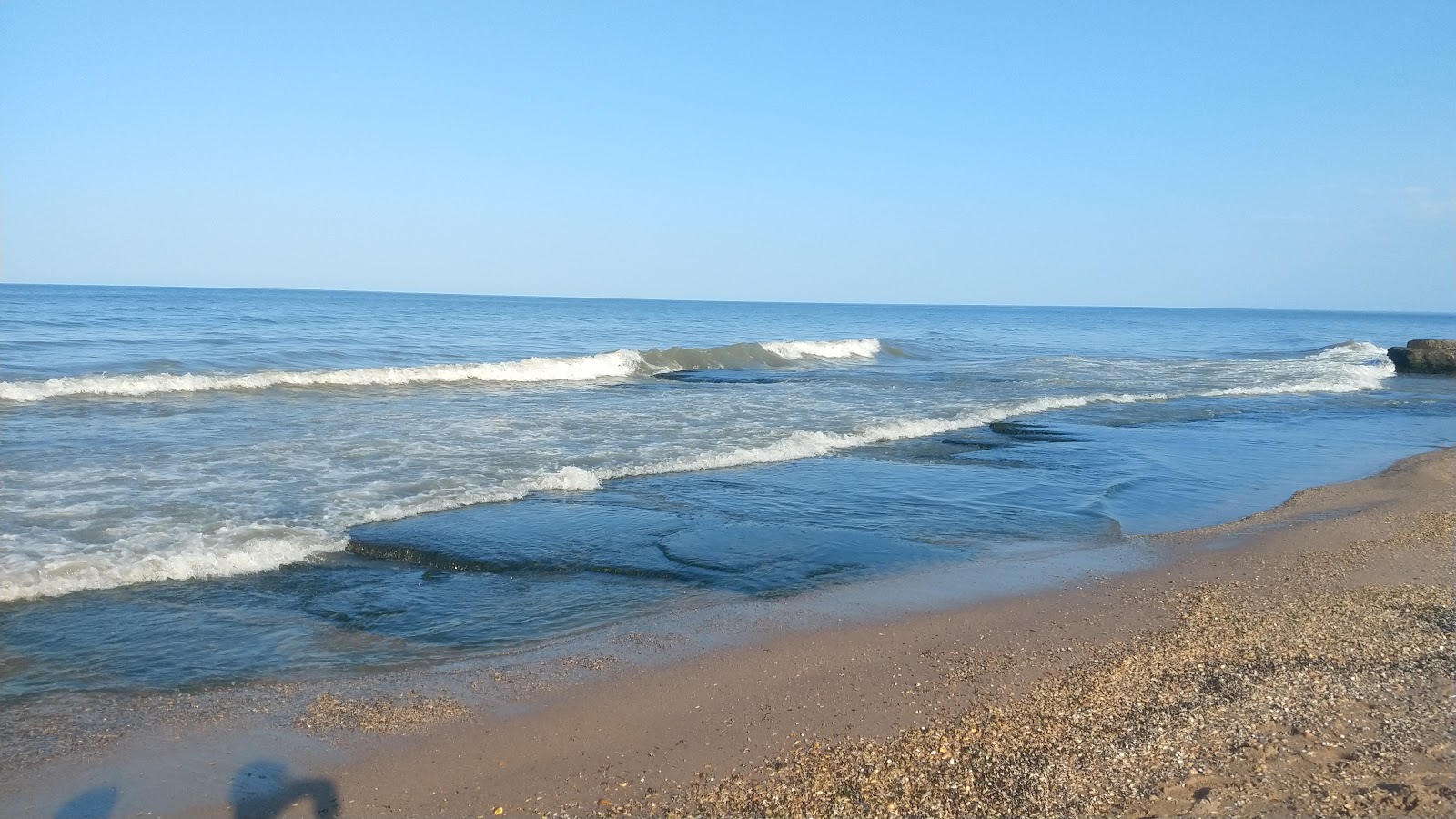 Photo de Derbent Beach avec rivage droit, long