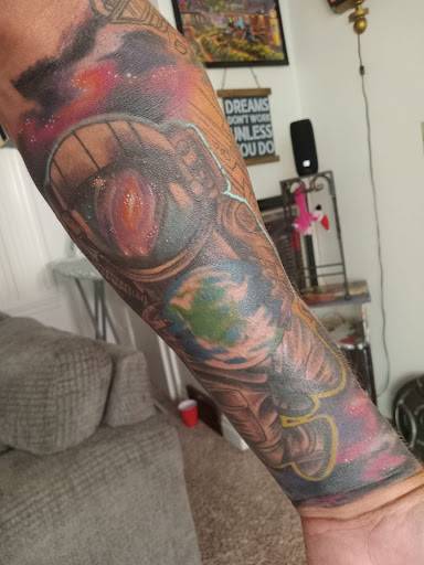 Explore forearm cross tattoo ideas, creative tattoo ideas in Erie, available at Code of Honor Tattoo