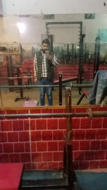 Malik Gym - F9J8+V5H, Pir Colony, Lahore, Punjab, Pakistan