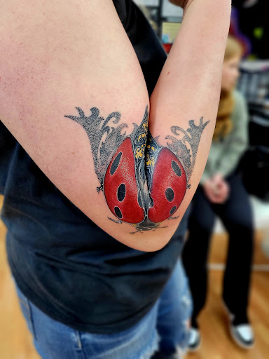 Explore baby yoda tattoo ideas, creative tattoo ideas in Benton, available at Spectrum Tattoo