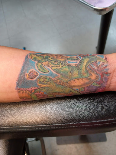 Explore colorful sleeve tattoo ideas, creative tattoo ideas in Alexandria, available at Turtles Ink