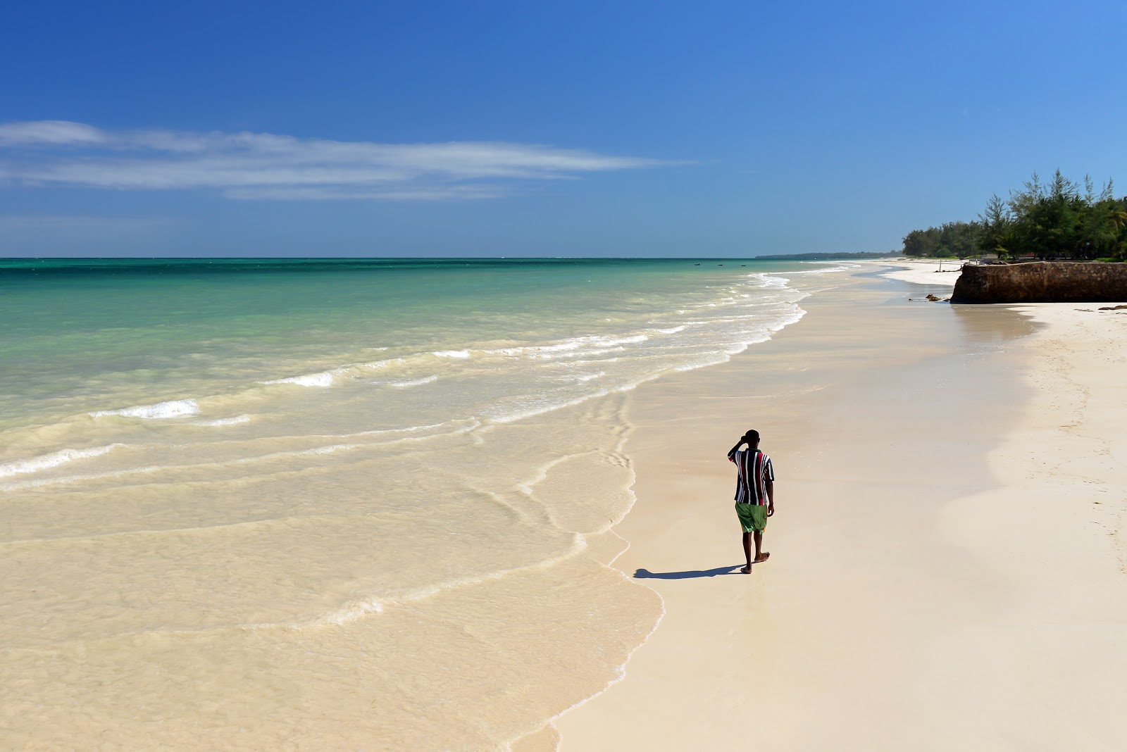 Photo of Diani Beach with turquoise pure water surface