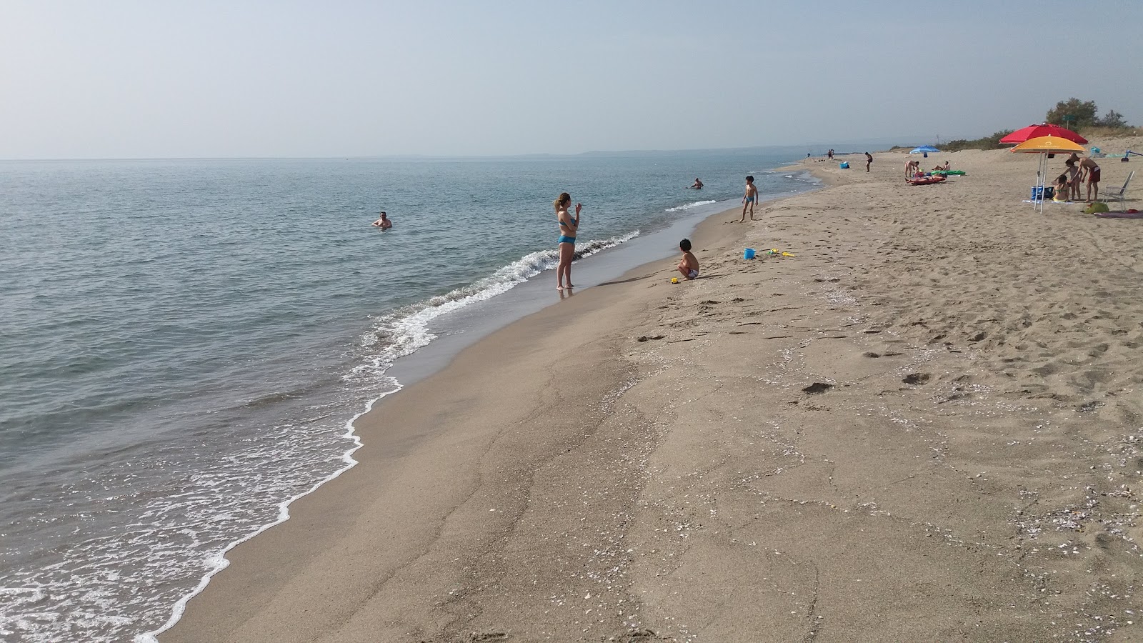 Fotografie cu Primosole beach II cu o suprafață de nisip maro