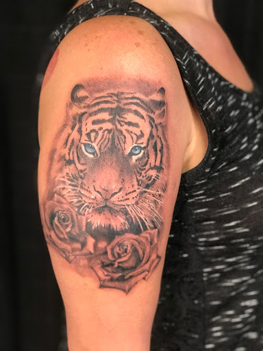 Explore grinch tattoo ideas, creative tattoo ideas in Ocala, available at The Tattoo Gallery of Ocala LLC