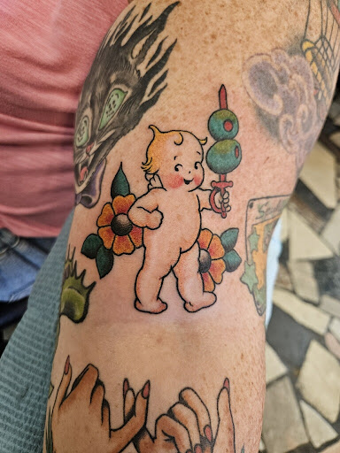 Explore campfire tattoo ideas, creative tattoo ideas in New Orleans, available at Downtown Tattoos and Piercing