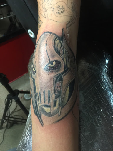 Explore knee tattoo ideas for men, creative tattoo ideas in Dover, available at Walls of Wonder Tattoo And Body Piercing