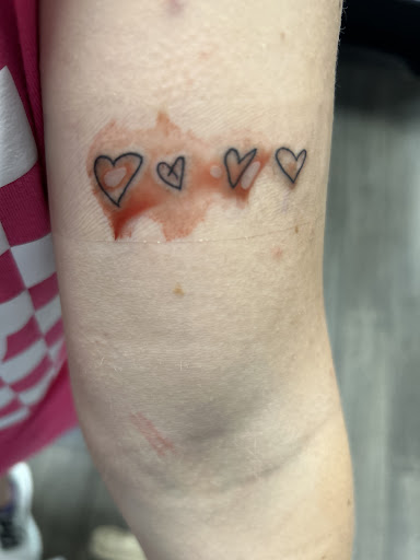 Explore family flower tattoo ideas, creative tattoo ideas in Fayetteville, available at Evolution Ink Tattoo and Piercing Studio