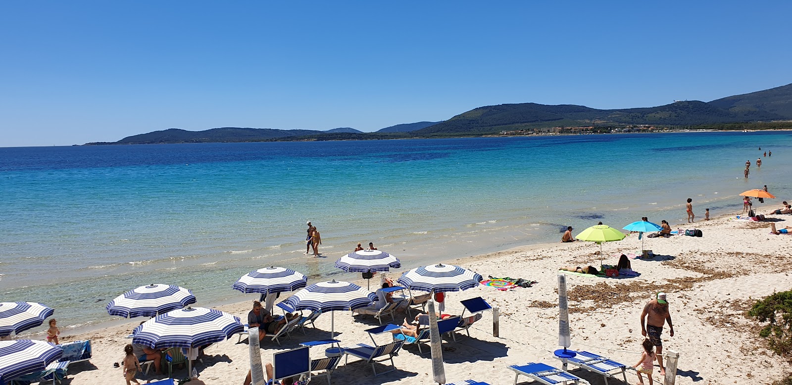 Photo of Fertilia beach - recommended for family travellers with kids