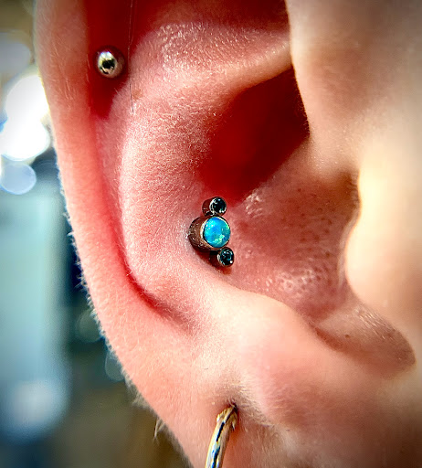 Explore religious tattoo cover up ideas, creative tattoo ideas in Orange, available at Symbiosis Body Piercing