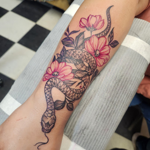 Explore thigh tattoo ideas woman, creative tattoo ideas in Augusta, available at Mr. Tattoo