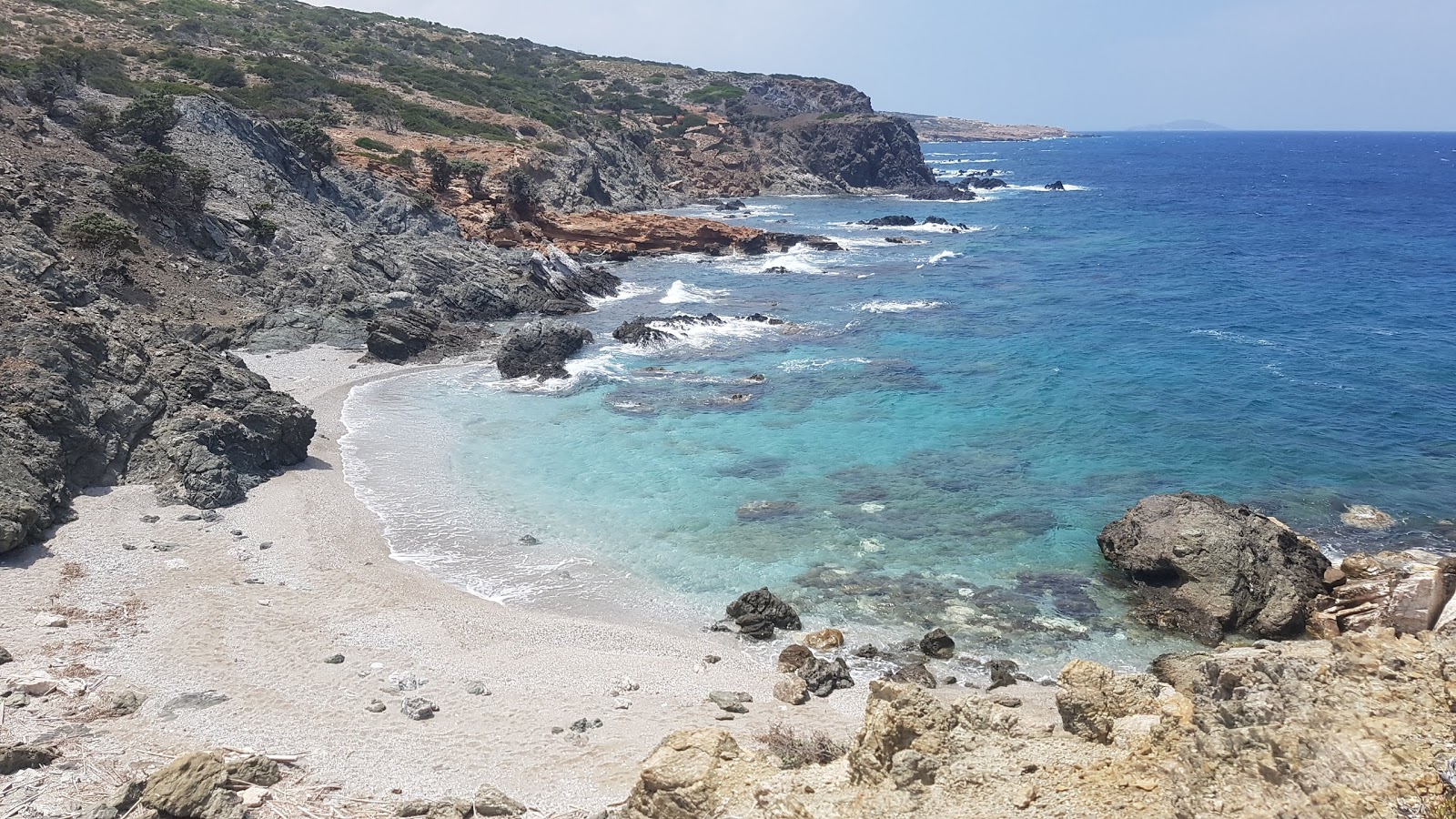 Foto av Turkaylako Beach med ljus sand yta