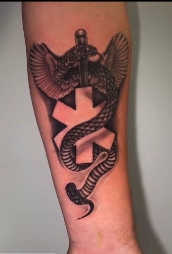 Explore black and white voodoo/ragdoll broken heart tattoo ideas, creative tattoo ideas in Fort Wayne, available at Grade A Tattoos and Body Piercing