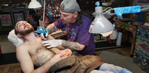 Explore women's cover up tattoo ideas, creative tattoo ideas in Sigourney, available at Octopus Ink Professional Tattoo & Piercing