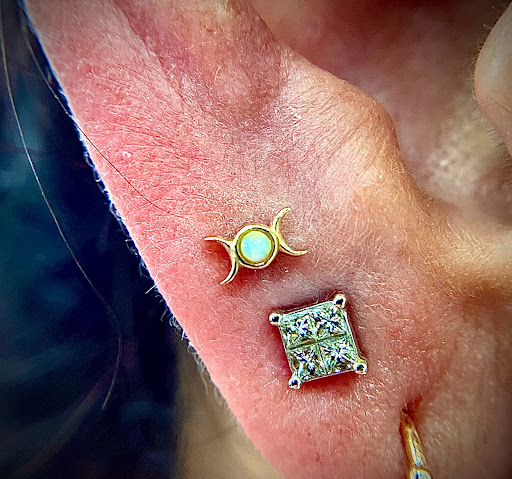 Explore three cross tattoo ideas, creative tattoo ideas in Orange, available at Symbiosis Body Piercing