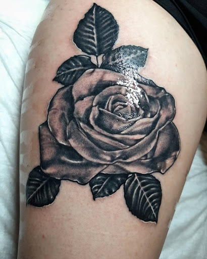 Find tattoo ideas with roses for your next unique tattoo in Lakeview at Backwoods Tattoo Studio