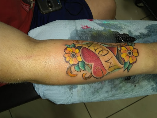 Explore purple flower tattoo ideas, creative tattoo ideas in Tampa, available at Ink Villains Tattoos