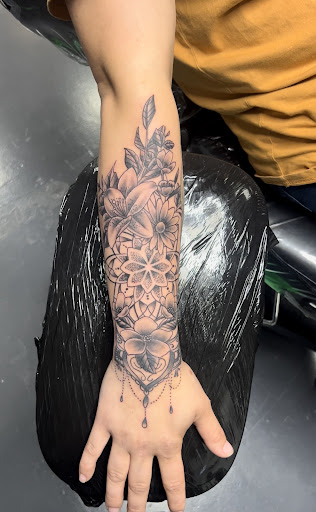 Find in between breast tattoo ideas for your next unique tattoo in Meridian at Creative Pain Tattoo Studio