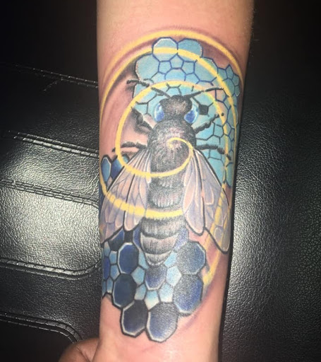 Explore single flower tattoo ideas, creative tattoo ideas in Savannah, available at Tatlyfe Studios