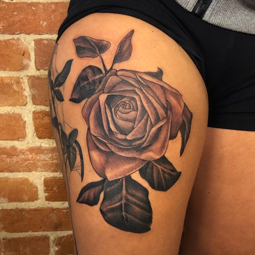 Explore behind ear tattoo ideas for guys, creative tattoo ideas in Buffalo, available at The Tilted Rose Tattoo