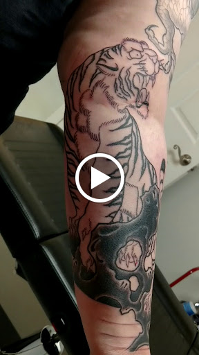 Explore poke and stick tattoo ideas, creative tattoo ideas in Marietta, available at Monkeys Uncle Tattoo