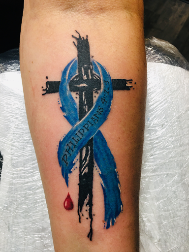 Explore cover up tattoo ideas male arm, creative tattoo ideas in Warner Robins, available at Untold Pain Tattoo Studio