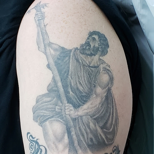 Explore toothless tattoo ideas, creative tattoo ideas in Lansing, available at Local Tattoo and Laser Company