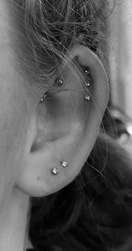 Explore random tattoo ideas for guys, creative tattoo ideas in Logan, available at Surreal Ink Tattoo & Body Piercing