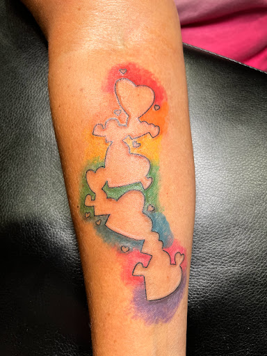 Explore spina bifida tattoo ideas, creative tattoo ideas in Cape Coral, available at UNRIVALED INK