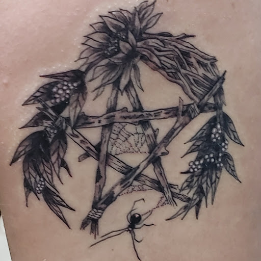 Find arm band tattoo ideas for your next unique tattoo in Cornelia at Prismatic Pulse Tattoo