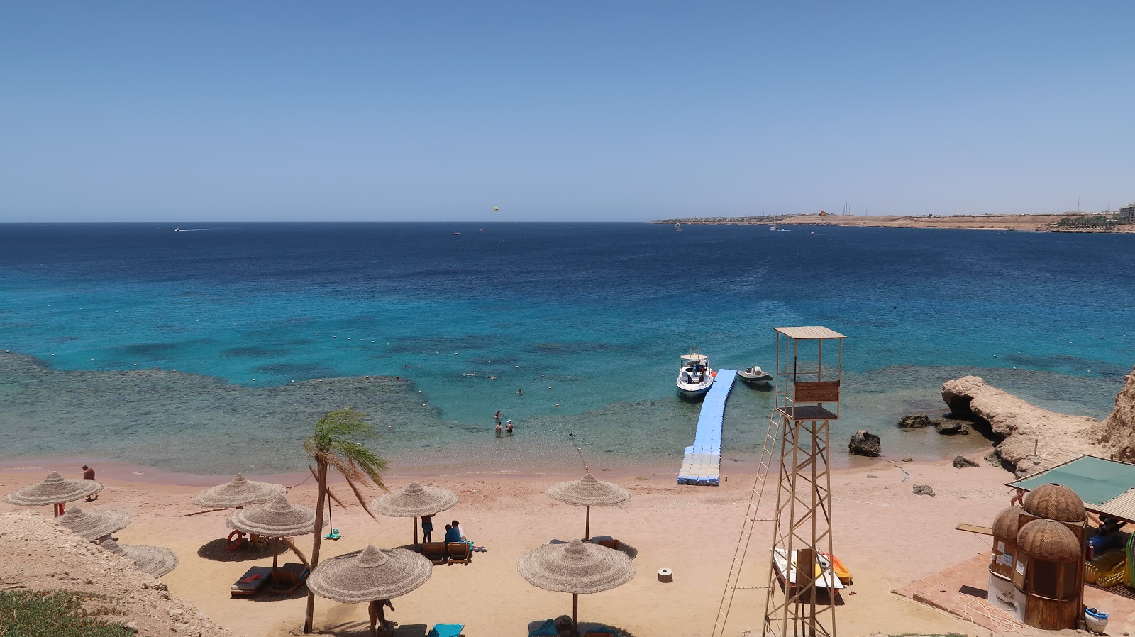 Photo of Movenpick Resort beach and the settlement