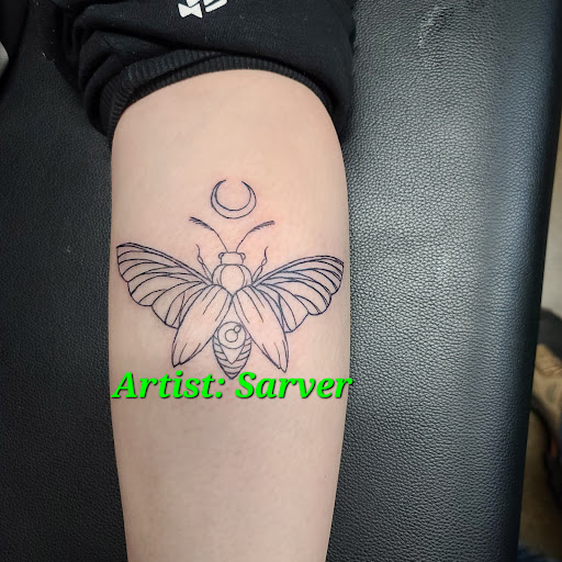Explore black and white voodoo/ragdoll broken heart tattoo ideas, creative tattoo ideas in Ottawa, available at Precision Art