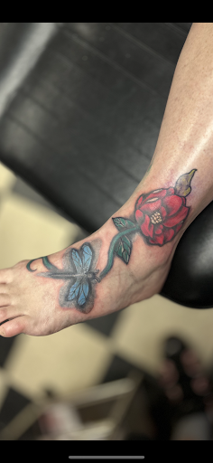 Explore male calf tattoo ideas, creative tattoo ideas in Demotte, available at Revelations Tattoo Parlor