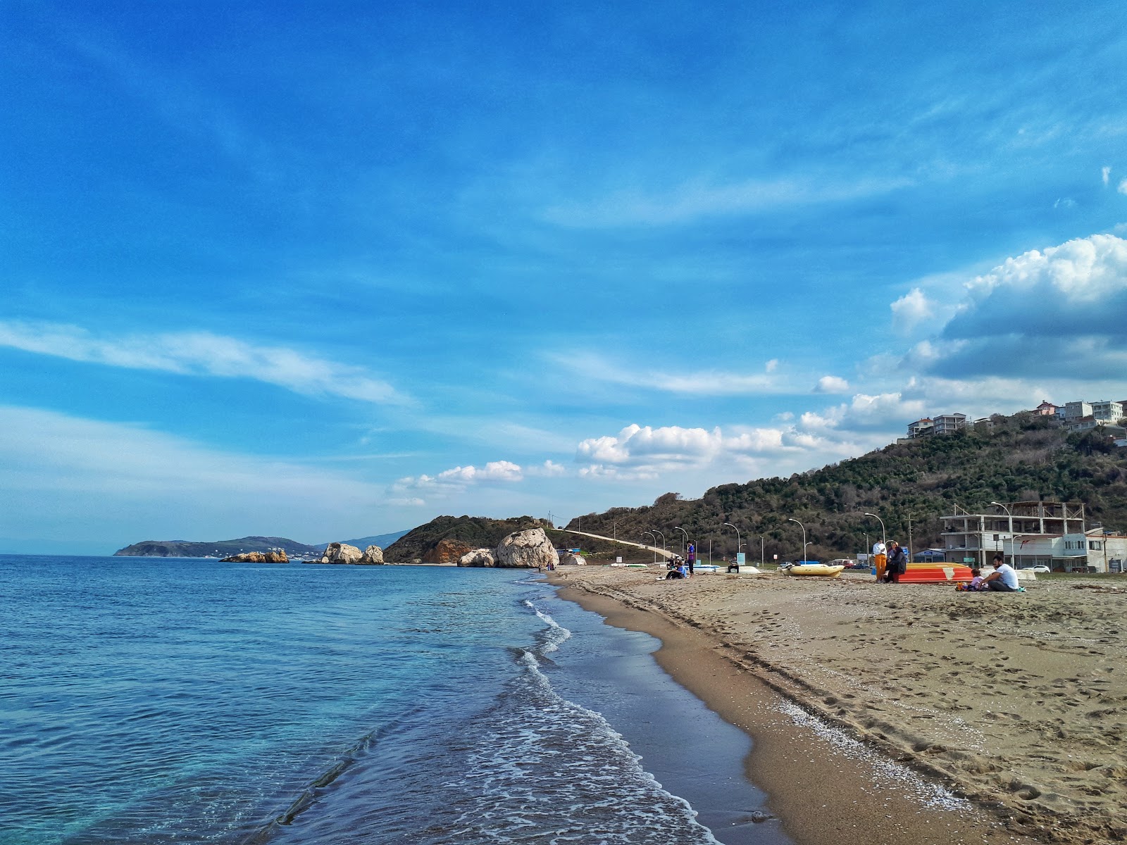 Foto de Egerce beach con arena beige superficie