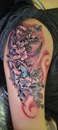 Explore thigh tattoo ideas male, creative tattoo ideas in Angola, available at Hoodlum Ink