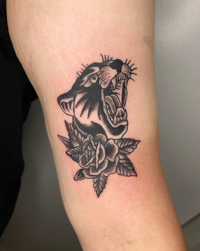 Explore black and white flower tattoo ideas, creative tattoo ideas in Milwaukee, available at The Skin Museum