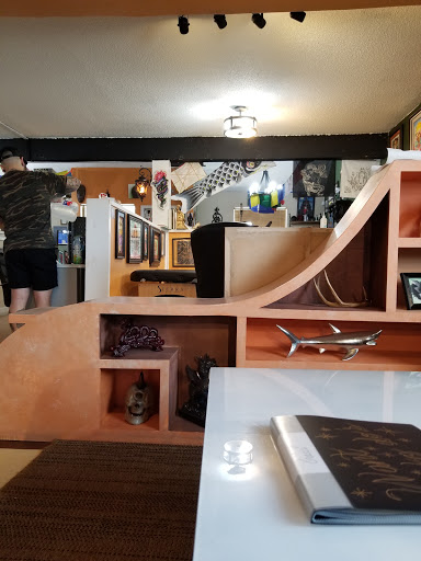 Explore leg tattoo cover up ideas for men, creative tattoo ideas in North Charleston, available at Breakthrough Tattoo