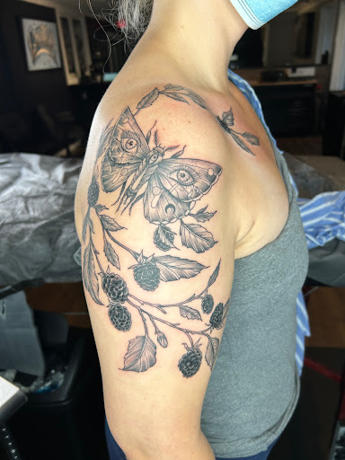 Explore cover up tattoo ideas on ankle, creative tattoo ideas in Traverse City, available at Black Candle Tattoo Co.