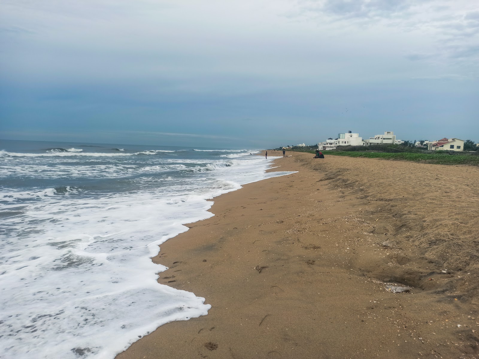 Φωτογραφία του Olive Beach με φωτεινή άμμος επιφάνεια